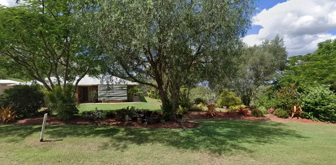 Tidy garden beds framing a house on a Gatton property