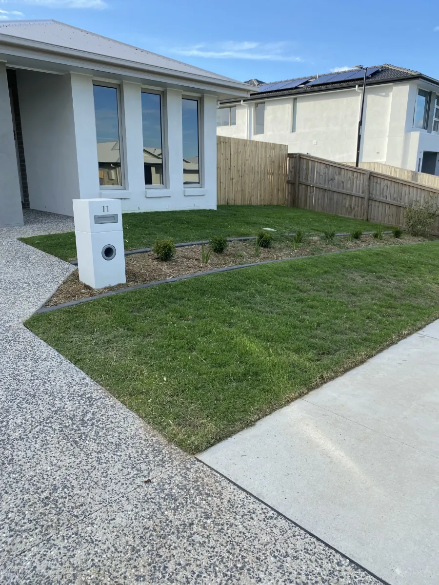 Weed treatment applied through garden beds on a Plainland property
