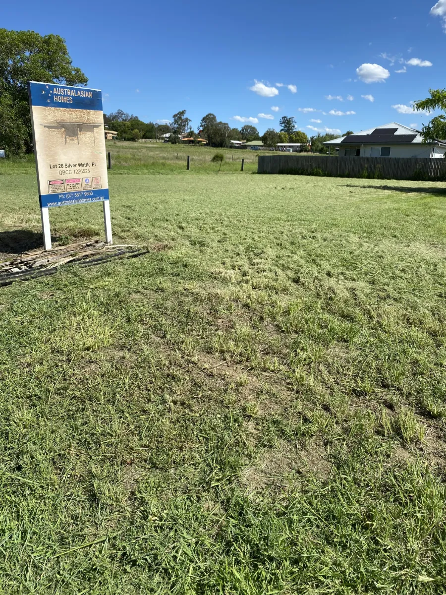 Vacant residential block slashed down flat beside a builder's sign at Laidley QLD